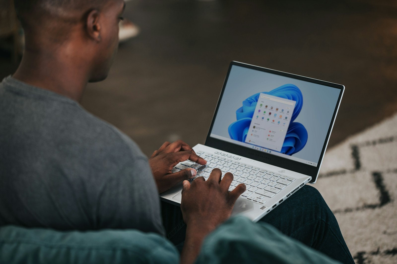 Business user upgrading to Windows 11 securely with IT support